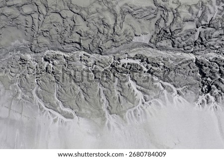 Abstract mud cracks and patterns aerial view by drone