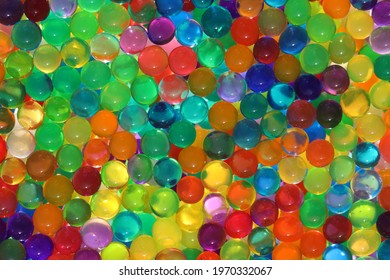 An Abstract Multicolored Light Background With Hydrogel Pearl Texture, Water Suction Balls