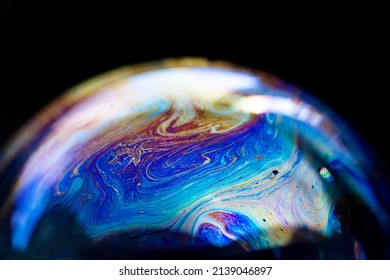 Abstract multicolored pattern, chaotic texture inside of the soap bubble, closeup. High quality FullHD footage.