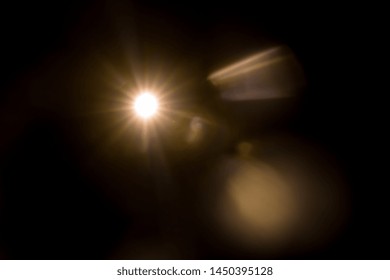 Abstract Natural Sun Flare On The Black