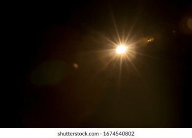 Abstract Natural Sun Flare On The Black