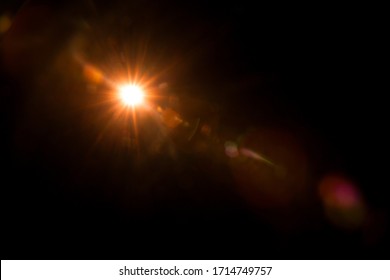 Abstract Natural Sun flare on the black - Shutterstock ID 1714749757
