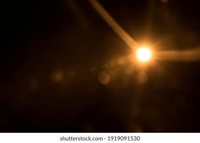 Abstract Natural Sun Flare On The Black