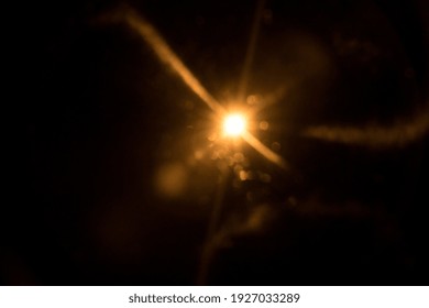 Abstract Natural Sun Flare On The Black