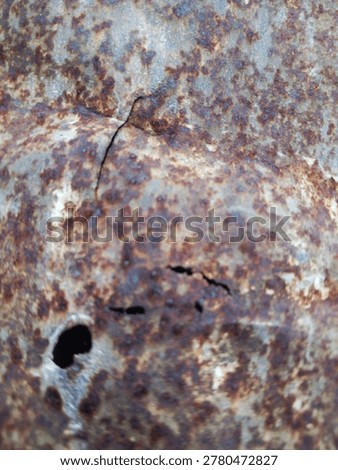 Abstract natural texture of corroded rusty iron sheet with holes and cracks