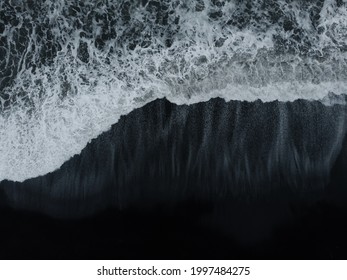 Abstract Nature Background. Aerial Drone View Of Black Sand Beach And Ocean Waves In South Iceland