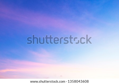 Abstract nature background of romantic pastel sky with silky & wispy cloud in  golden hour time at spring evening. Beautiful puffy & fluffy clouds in bright blue sky in morning sunlight, copy space