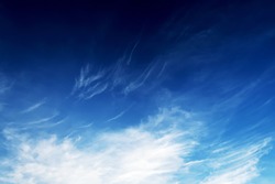 Abstract Nature Dark Background Of  White Cirrus Clouds Expanding By Wind To Cover Deep Navy Blue Sky In Tropical Summer Sunlight For Backdrop Or Wallpaper, Copy Space                                 