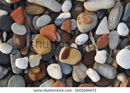 Abstract nature pebbles background. Blue stone pebbles texture. Stone background. Blue vintage color. Sea pebble and sea glass beach. Beautiful nature background. Sea pebbles wallpaper in colorful.