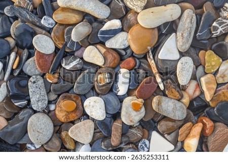 Abstract nature pebbles background. Blue stone pebbles texture. Stone background. Blue vintage color. Sea pebble and sea glass beach. Beautiful nature background. Sea pebbles wallpaper in colorful.