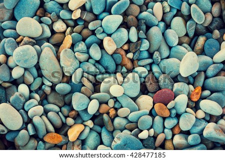 Abstract nature pebbles background. Blue pebbles texture. Stone background.  Blue vintage color. Sea pebble beach. Beautiful nature. Turquoise color