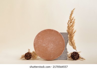 Abstract nature scene composition of stones Dried flowers, Cone, Empty terra brown round stone podium product placement concept on biege background. interior design. copyspace. - Powered by Shutterstock