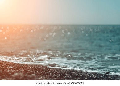 Abstract nature summer ocean sunset sea background. Small waves on water surface in motion blur with bokeh lights from sunrise. Holiday, vacation and recreational background concept - Shutterstock ID 2367220921