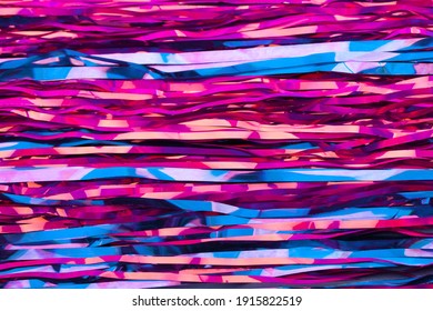 Abstract neon pink and blue background. New Year's tinsel. Active lines.