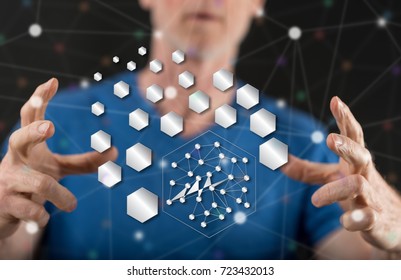 Abstract network concept between hands of a man in background