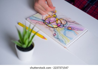 Abstract neurographic drawing with colored pencils. Close-up of hands drawing neurographic art. Neurographic Art - a modern method of art therapy - Shutterstock ID 2237371547