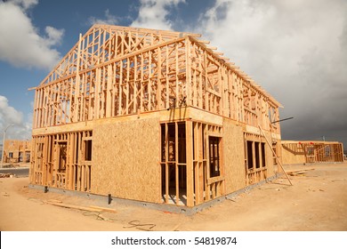 Abstract Of New Home Construction Site Framing.