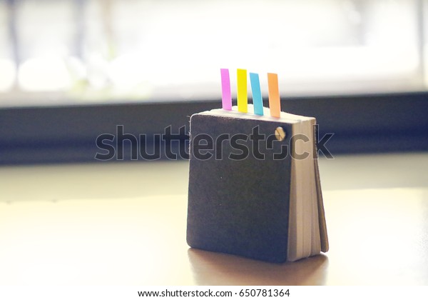 Abstract notebook with color\
note tab