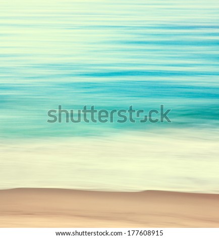 An abstract ocean seascape with blurred panning motion.  Image displays a retro look with cross-processed colors.