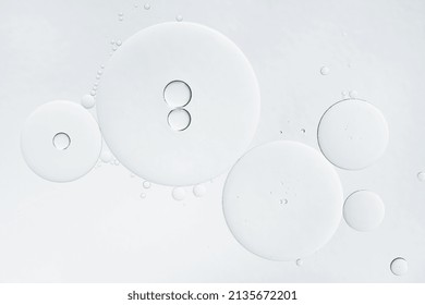 Abstract oil bubbles background. Cosmetic liquid beauty product. Face serum texture.