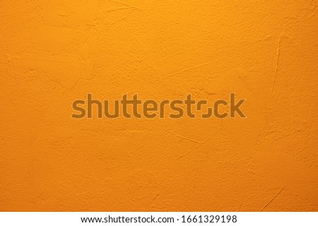 Abstract orange concrete texture background.Orange color cement wall texture for interior design.copy space for add text.