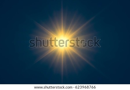 Abstract orange sparkling light rays and lighting flare bokeh against on dark blue sky background