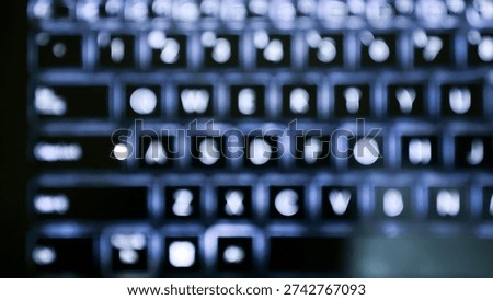 Abstract out of focus view of backlit laptop keyboard