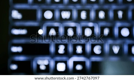 Abstract out of focus view of backlit laptop keyboard