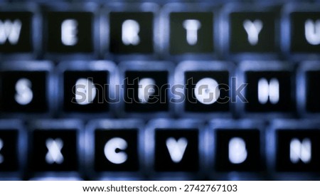 Abstract out of focus view of backlit laptop keyboard