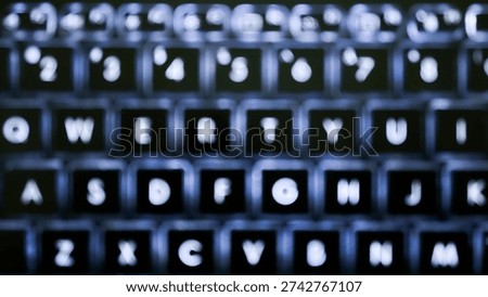 Abstract out of focus view of backlit laptop keyboard