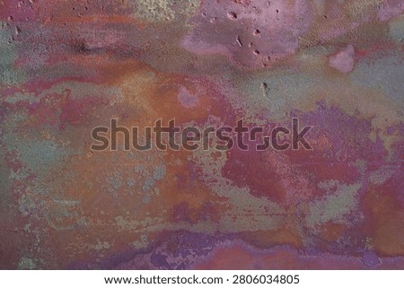 Abstract oxidized copper texture with pink, purple and orange patina. Colorful copper corrosion background with aged metal surface, verdigris details, weathered metallic pattern and rustic grunge texture