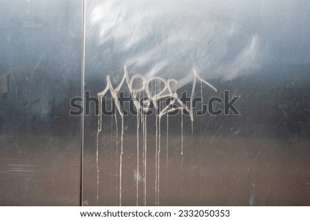 Abstract paint pattern on  silver steel wall background texture