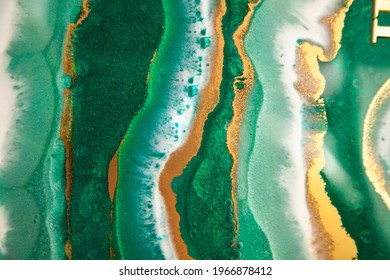 Abstract Painting With Epoxy Resin. Marble Streaks Of Green,white And Gold. Abstract Modern With Streaks Liquid Background For Design