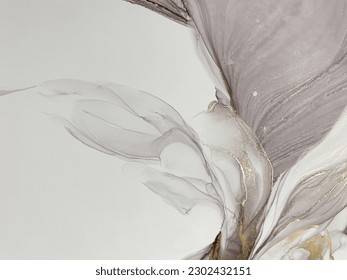 Abstract pale pink art with gold — light purple background with golden paint. Beautiful smudges and stains made with alcohol ink. Light pink fluid art texture resembles petals, watercolor or aquarelle