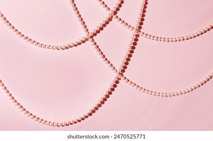 Abstract pale pink background, luxurious, elegant pearl strings.