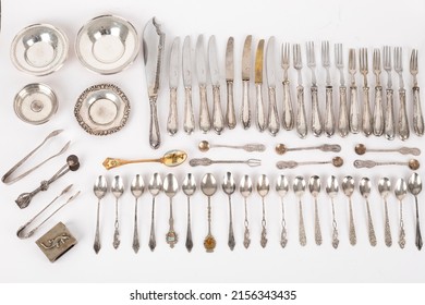 Abstract Pastel Background Image Made Of Silver Antique Home Kitchenware Objects Cutlery Composition On White Backdrop Buying Now. 