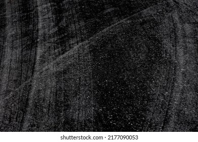 Abstract pattern background image. concrete surface. Modern black tones. Wheel marks on the floor.