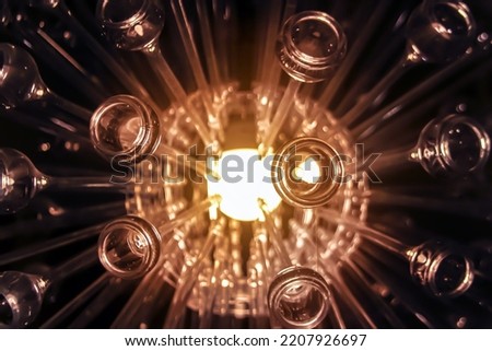 Abstract pattern corona explotion from glass tube with light on center in big bang concept