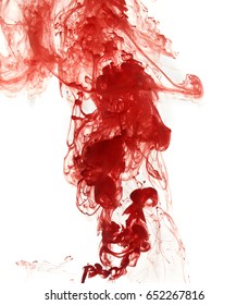 Abstract pattern falling into the water drop of red ink