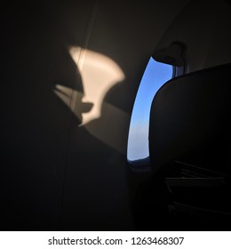 Abstract pattern of light and shadows with aircraft windows and refraction through spectacles