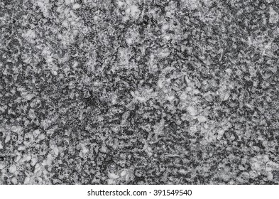 Abstract pattern and texture from defaced public park concrete benches / Abstract background / Due to exposure to sun and rain the original color faded 