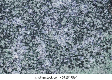 Abstract pattern and texture from defaced public park concrete benches / Abstract background / Due to exposure to sun and rain the original color faded 