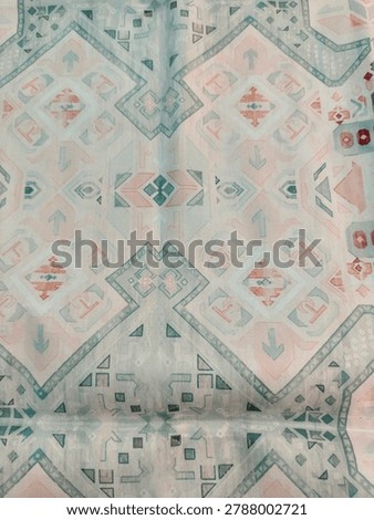 abstract patterned prayer mat with blue and gray nuances