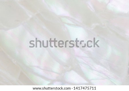 Abstract pearl background with soft shimmering mother of pearl lilac and rainbow colours