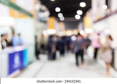 Abstract  people walking in exhibition blurred background