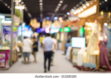 Abstract People Walking At Exhibition Market Blur Background With Bokeh ,Concept Business Small And Medium  Enterprises