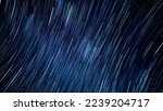 Abstract photo of Blue Night sky star trail background.Startrails on a dark blue sky at night,center sky area.