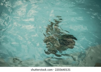 Abstract Photo Lifestyle, Nature Background. Unrecognizable Person Body Deep Under Water, Look At Surface. Mystery Mood. Concept Of Weightless, Uncertain Future, Drown In Obscurity, Childhood Issues