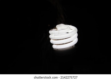 Abstract Photo One Light Bulb Illuminated Against A Black Background. Convey An Idea Spark Ideas To Be Disturbed By Something With Copy Space For Artwork.