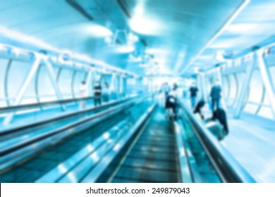 Abstract Photo Picture Of Moving Walkway And Blurred People On Background.